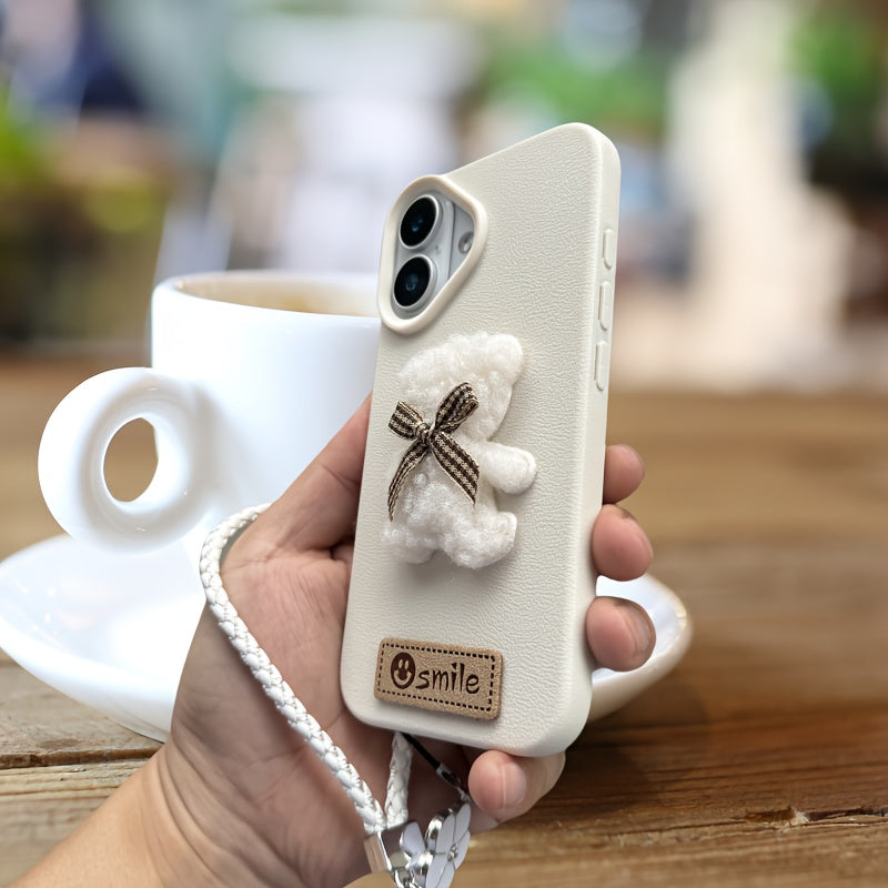 A Single-Pack Plush Teddy Bear Phone Case with a Bow, Available in White And Brown. It Comes with a Wrist Strap And Features a Simple And Elegant Faux Leather Texture That Is Anti-Slip And Fingerprint-Resistant. Made with TPU